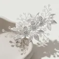 Macro detail of handmade floral bridal clip with pearls and silver metal flowers - Silver