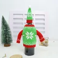 Detail of red and green knitted Christmas wine bottle cover with white snowflake pattern - Green Snowflake Style