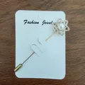 Elegant gold safety pin brooch with star-shaped crystal and pearl on a card - Hexagram Star Style (Hexagram)