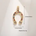 Macro detail of gold horseshoe charm with multi-colored cubic zirconia and dimensions - Gold Multi-Color Zirconia Horseshoe