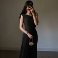 Detail of elegant black one shoulder ruched evening gown with pleated texture - XS / Black