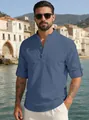 Close-up of blue linen blend shirt with mandarin collar and button detail for men - Navy Blue