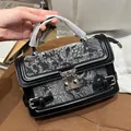 Retro black leather handbag with white floral embroidery and heart wing buckle - Black