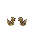 Close-up of brass bird figurines with vintage textured finish and detailed metal carving - Yellow Duck