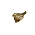Macro shot of antique brass bird statue with detailed metal carving and texture - Sparrow