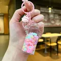 Glow-in-the-dark drifting bottle keychain with pink bell and macaron glitters - Luminous Snowflake (Colored Hardware) / Lobster Clasp Style / Pink