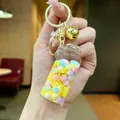 Luminous drift bottle keychain with macaron beads and gold bell pendant - Luminous Snowflake (Gold Hardware) / Lobster Clasp Style / Yellow