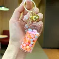 Creative drifting bottle keychain with colorful bubble beads and golden bell charm - Luminous Snowflake (Gold Hardware) / Lobster Clasp Style / Orange