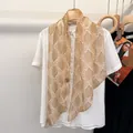 French retro paisley silk scarf in champagne gold paired with a white shirt - Golden Flower