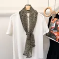 Dark green mulberry silk scarf with yellow geometric dots on a white shirt - Celadon Floral
