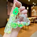 Porte-clés moto créatif avec sable mouvant vert et dragonne en gelée souple - Moto En Corde Florale Verte Avec Flocon De Neige Lumineux