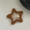 Close-up of brown plush yarn-wrapped star hair clip with golden metal snap fastener - Knitted Pentagram Style (E3.4/J79-B2) / Tan