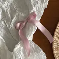 Detail of light pink satin bow hair clip with long ribbons on artistic background - Pink Satin Bow Duckbill Clip (52-B82) / Pink