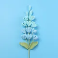 Handmade crochet flowers in light blue and azure with green leaves on blue background - Lilac / Gradient Blue