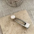 Elegant silver metal hair clip featuring a large white faux pearl on stone surface - Artificial Pearl Decor Style / Light Pink