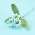 Handmade crochet light blue bell flowers with green leaves on blue background - Lily of the Valley Bouquet / Blue