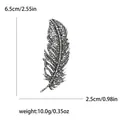 Broche de pluma vintage con diamantes grises medidas 6,5cm de largo y peso de 10g - Plata Antigua Negro Brillante