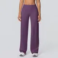 Detail of high-waisted dark purple yoga flare pants with wide waistband and draped fit - Purple Thistle