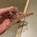 Close-up of champagne crystal claw clip with transparent acrylic and metal spring - Champagne (B5-211)