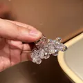 Detailed macro view of a large purple crystal shark hair claw clip for elegant styling - Small / Light Purple