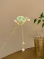 Elegant gold hair stick with green magnolia petals, pearls, and a long tassel pendant - Green Tassel