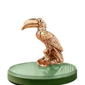 Detailed close-up of a vintage brass toucan figurine with fine feather textures - Toucan