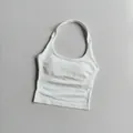 Detail of white square neck sports bra with ribbed side panels and removable pads - White