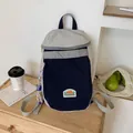 Minimalist kids backpack in navy blue and light grey color block design with charm - Gray Blue