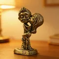 Macro detail of bronze kissing couple figurine featuring romantic 13 14 base engraving - Passionate Couple