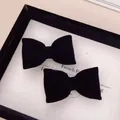 Set of two black velvet bow hair clips with a classic vintage elegant design - Large Velvet Black