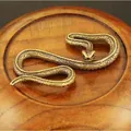Macro shot of realistic copper cobra scales on a textured solid brass snake figurine - Medium Snake