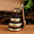 Macro view of vintage brass snake incense holder with detailed scale textures - Incense Holder Snake
