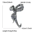 Detailed view of luxury bow brooch with dimensions 7.0x4.2cm and rhinestone inlay - Antique Silver Blue Purple Rhinestone
