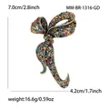 Elegant gold vintage bow brooch with colorful rhinestones measuring 7.0cm by 4.2cm - Antique Gold Multi-color Rhinestone