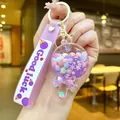 Purple sakura liquid glitter keychain with frosted strap and Good luck text detail - Purple Glow-in-the-dark Bean Cheese Sticks