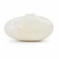 Macro detail of oval acrylic clutch with iridescent shell texture and smooth finish - White