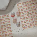 Red bow and gold star nail art stickers model Co-581 on shimmering manicured nails - Red Line Bow and Gold Star Style (CO-581)