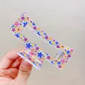 Large square acrylic hair claw with colorful floral patterns and transparent base - Blue Flower