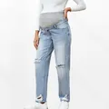 Close-up of maternity jeans featuring distressed knee holes and high elastic waist band - S / Light Blue