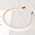 Elegante dubbele rij parel haarband met een gouden basis en zwarte bescherming - Twee Rijen Kleine Kunstparels Stijl
