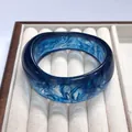 Wide irregular resin bangle with deep blue marble texture and smoke pattern finish - Ocean Blue