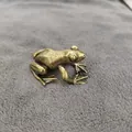 Detailed close-up of a vintage solid brass frog sculpture with realistic texture - Smooth Frog