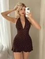 Detailed view of deep V-neckline and halter style on polka dot summer dress - S / Coffee
