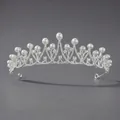 Elegant silver crown featuring white pearls and sparkling rhinestones in an arched design - Pearl Princess Party Crown Ts-j2593
