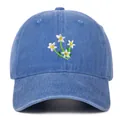 Detailed view of floral embroidery on blue washed denim cotton baseball cap - One Size / Light Blue