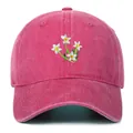 Close-up of small white daisy floral embroidery on magenta cotton baseball cap - One Size / Rose Red