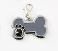 Bone-shaped pet tag in dark gray enamel with a black rhinestone paw print detail - Bone / 30*28mm / Gray
