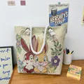 Off-white canvas tote bag featuring embroidered double rabbits and floral patterns - Rabbit Pattern