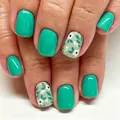 Short square floral press-on nails in mint green and white leaf pattern with glossy finish - Yellow Jelly Glue Style
