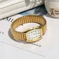 Gold rectangular quartz watch with white dial and elastic metal stretch strap - Women's White Dial / Gold
